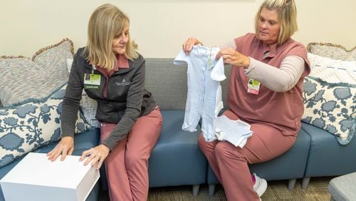  Northeast Georgia Medical Center Bereavement team members Chaplain Reverend Karen Hoyt M.Div, BCC (left) & Mandy Reichert, PhD, RN, PT-CSP look through their assortment of baby clothes that they can offer for burials. A nurse who has the sad duty of dressing for burial babies that don't make it contacted a manufacturer of really smart children's clothes. He has given them some and they are needed because some parents don't have or can't afford a proper burial outfit for their babies. For Inspire Atlanta about nurses going above and beyond.  PHIL SKINNER FOR THE ATLANTA JOURNAL-CONSTITUTION