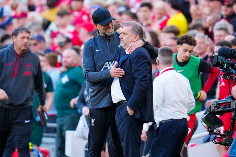 Liverpool's manager Jurgen Klopp, left, hugs Tottenham's head coach Ange Postecoglou at the end of the English Premier League soccer match between Liverpool and Tottenham Hotspur at Anfield Stadium in Liverpool, England, Sunday, May 5, 2024. (AP Photo/Jon Super)