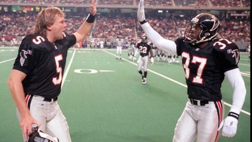 Morten Andersen (left) gives Elbert Shelley a high five after Shelley made a big hit on special teams in 1995. (AJC photo/Jonathan Newton)