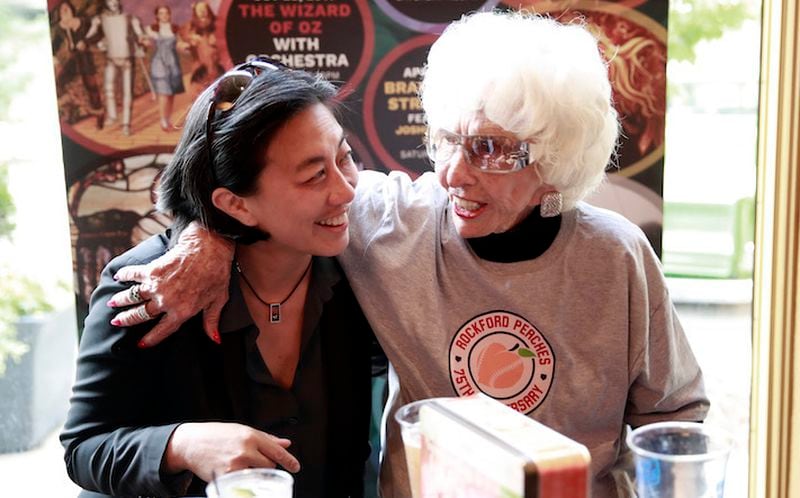 Kim Ng, Major League Baseball senior vice-president for baseball operations, and right, Maybelle Blair, who played in 1948 for the Peoria Redwings, during a celebration of the Rockford Peaches' 75th Anniversary. (Nuccio DiNuzzo/Chicago Tribune/TNS)