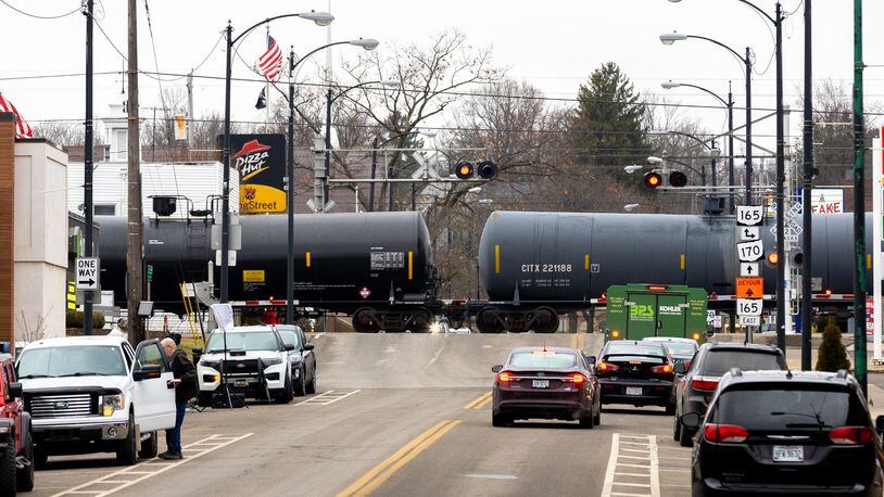 A train passes through East Palestine, Ohio on Friday, February 17, 2023. About 38 cars of a Norfolk Southern train derailed Feb. 3 in East Palestine. Among the derailed cars were five hazardous materials cars carrying vinyl chloride. (Arvin Temkar / arvin.temkar@ajc.com)