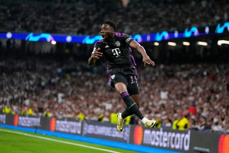 Bayern's Alphonso Davies celebrates after scoring his side's opening goal during the Champions League semifinal second leg soccer match between Real Madrid and Bayern Munich at the Santiago Bernabeu stadium in Madrid, Spain, Wednesday, May 8, 2024. (AP Photo/Manu Fernandez)