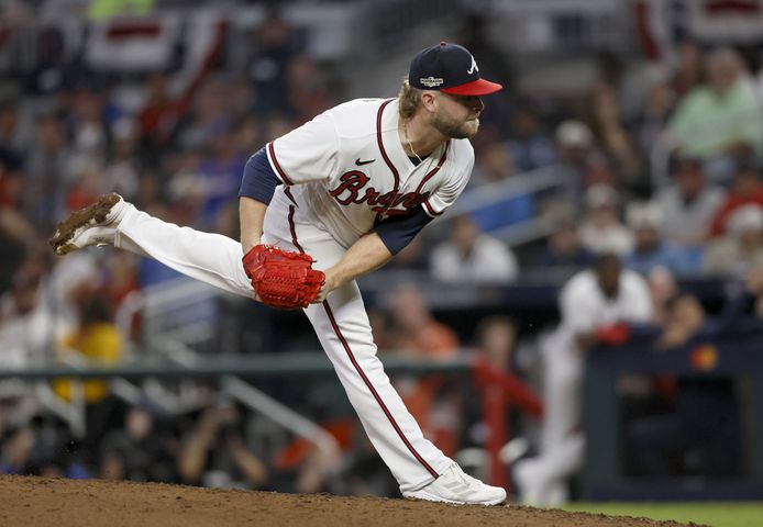 Atlanta Braves relief pitcher A.J. Minter (33) delivers to the Philadelphia Phillies during the seventh inning of game two of the National League Division Series at Truist Park in Atlanta on Wednesday, October 12, 2022. (Jason Getz / Jason.Getz@ajc.com)