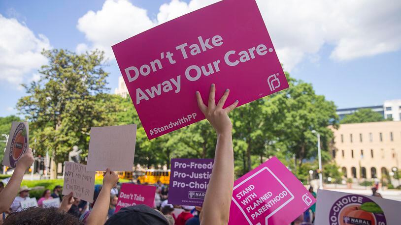 05/07/2019  -- Atlanta, Georgia -- Anti-Abortion protestors rally outside of the Georgia State Capitol building following the signing of HB 481 in Atlanta, Tuesday, May 7, 2019.  Georgia Governor Brian Kemp signed the bill, surrounded by supporters and Georgia lawmakers, in his office Tuesday morning.  (ALYSSA POINTER/ALYSSA.POINTER@AJC.COM)
