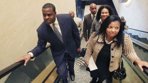 Atlanta City Attorney Cathy Hampton, seen here in a 2011 photo with Mayor Kasim Reed, will leave her position in late May, the city said Tuesday.