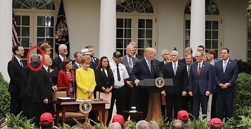 That's Johnny Isakson's head, circled in red. From last Wednesday's Rose Garden ceremony at the White House, at which President Donald Trump signed the VA Mission Act.  Chip Somodevilla/Getty Images