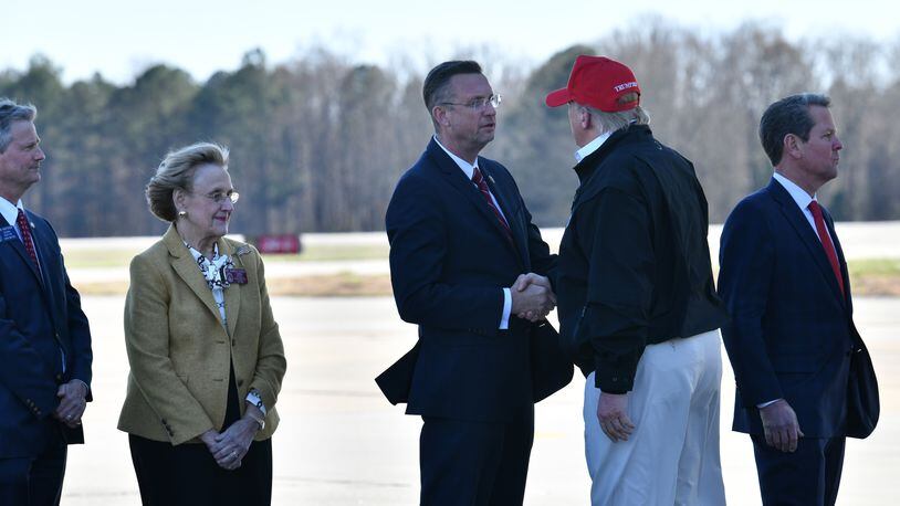 March 6, 2020 Atlanta - President Donald Trump is greeted by Rep. Doug Collins at Dobbins Air Reserve Base after the president's trip to tornado-ravaged Tennessee on Friday, March 6, 2020. President Donald Trump visited  the headquarters of the Centers for Disease Control and Prevention in Atlanta on Friday after all, after initially scrapping the trip over concerns that a staffer at the agency had contracted the coronavirus. (Hyosub Shin / Hyosub.Shin@ajc.com)