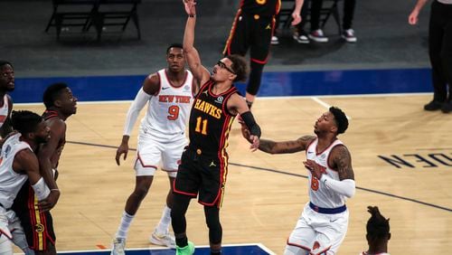 Atlanta Hawks guard Trae Young (11) shoots against the New York Knicks during the first quarter of an NBA basketball game Wednesday, April 21, 2021, in New York. (Wendell Cruz/Pool Photo via AP)