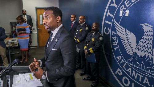 Atlanta Mayor Andre Dickens speaks at the podium on Tuesday, March 15, 2022, at a news conference at Atlanta's public safety headquarters. (John Spink / John.Spink@ajc.com)