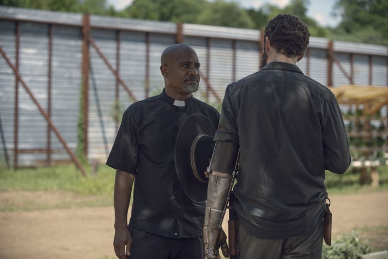 Seth Gilliam (left) played  Father Gabriel Stokes for seven seasons on "The Walking Dead." He is seen here during Season 9 inside "Alexandria" in Senoia. Courtesy of Gene Page/AMC