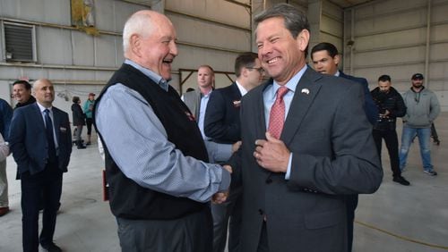 November 5, 2018 Atlanta - Agriculture Secretary Sonny Perdue and GOP gubernatorial candidate Brian Kemp share a smile ahead of Putting Georgians First Fly Around a day before the election day at Peachtree DeKalb Airport on Monday, November 5, 2018. HYOSUB SHIN / HSHIN@AJC.COM