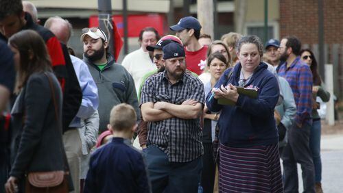 There was a more than an hour wait to vote at the Ponce De Leon Branch Library in Atlanta on Tuesday, November 8 2016. A Democrat poll observer said they had requested more machines. BOB ANDRES / BANDRES@AJC.COM