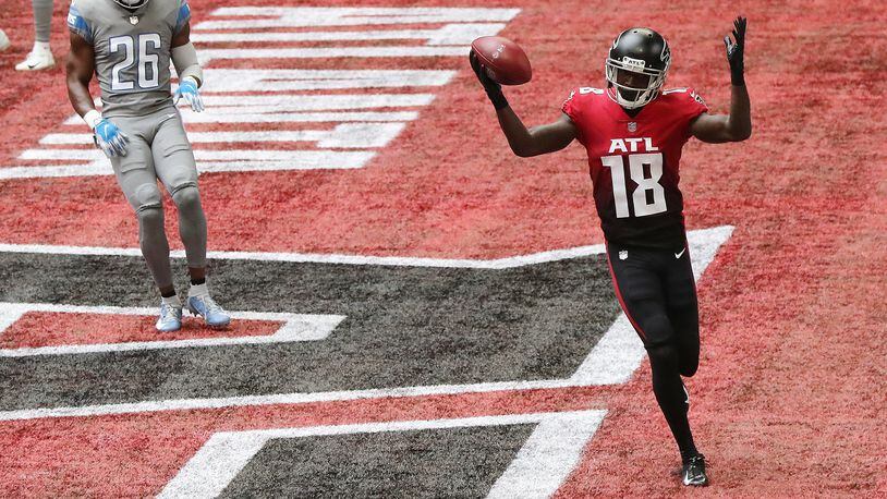 Falcons wide receiver Calvin Ridley celebrates a touchdown catch over Detroit Lions safety Duron Harmon on Oct. 25, 2020. (Curtis Compton / Curtis.Compton@ajc.com)