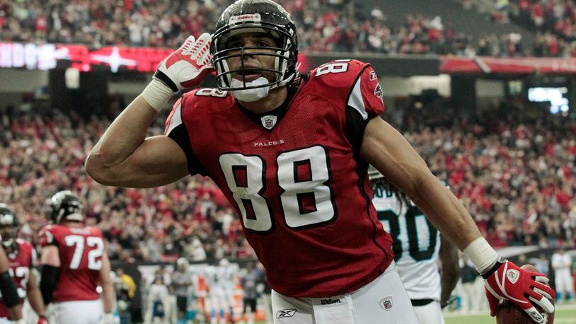 Atlanta Falcons tight end Tony Gonzalez reacts after scoring a touchdown against the Carolina Panthers in the first half of an NFL football game at the Georgia Dome in Atlanta Sunday, Jan. 2, 2011. (AP Photo/Dave Martin)