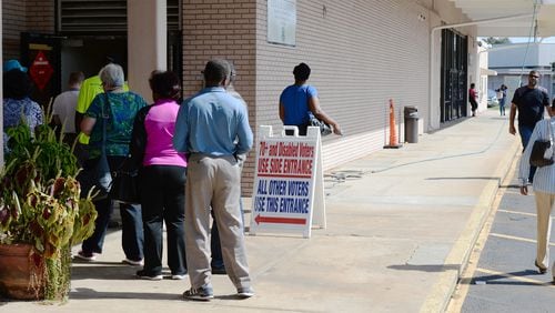 DeKalb County voters line up for early voting at the Voter Registration & Elections office Oct. 17. KENT D. JOHNSON / AJC