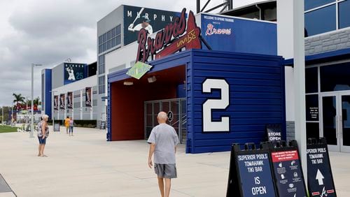 A few fans arrive to watch from the Tomahawk Tiki Bar at CoolToday Park in North Port, Fla., as the Braves play the Tampa Bay Rays in a minor-league game Thursday. (Curtis Compton / Curtis.Compton@ajc.com)