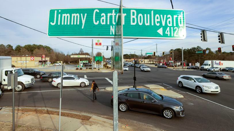 A Jimmy Carter Boulevard sign is shown at it’s intersection with Lawrenceville Highway on Monday, Feb. 20, 2023, in Norcross, Ga.. Former President Jimmy Carter, the Georgia native who is the longest living president in U.S. history, has decided against any further medical treatment and has entered home hospice care, the Carter Center said Saturday. “After a series of short hospital stays, former U.S. President Jimmy Carter decided to spend his remaining time at home with his family and receive hospice care instead of additional medical intervention,” the Atlanta-based center said. Jason Getz / Jason.Getz@ajc.com)