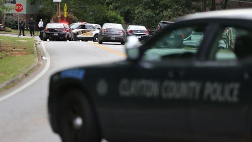 Multiple police vehicles were on the scene of an officer-involved shooting in Clayton County on Mon., May 16, 2016. BEN GRAY / BGRAY@AJC.COM