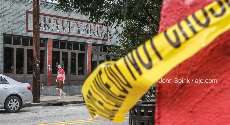 Crime scene tape could be seen on Flat Shoals Avenue on Thursday morning, hours after a 9-year-old and two men were injured in a shooting Wednesday night. All are expected to survive.