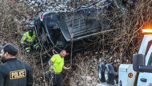 An SUV was hit by a train and pushed down an embankment Thursday morning in Duluth, police said. The driver was killed, but a passenger survived.