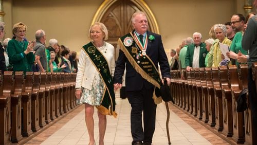 St. Patrick's Day Parade Committee Grand Marshal George Schwarz III and his wife Patricia Hodges Schwarz enter the Cathedral Basilica of St. John the Baptist for St. Patrick's Day Mass. (Photo Courtesy of Will Peebles)