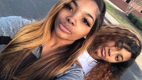 Fort Valley State University students Precious Waters (front) and Kearsten Robinson were in a Honda on Woolfolk Road about 10 p.m. Saturday when they pulled onto Ga. 49 and collided with a tractor-trailer hauling fertilizer.