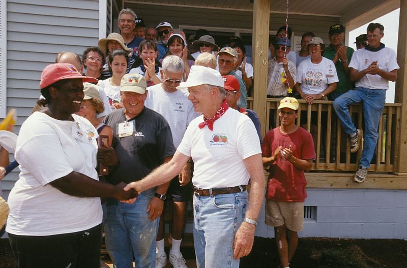 Carter shaking hands with a homeowner in Plains, Georgia. (Jimmy Carter Work Project 2000)