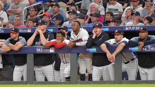Atlanta Braves players react in the dugout during the eighth inning against the Los Angeles Dodgers in Game 4 of a National League Division Series baseball game Monday, October 8, 2018, in Atlanta. The Braves lost 6-2. Hyosub Shin/hshin@ajc.com