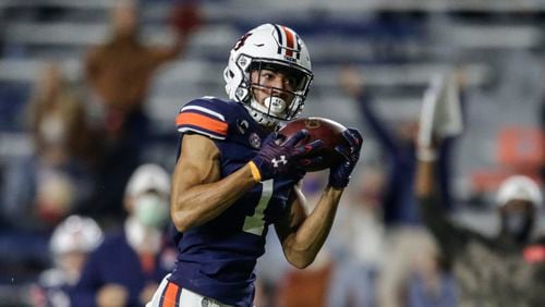 Auburn wide receiver Anthony Schwartz catches a pass for a touchdown during the first half of the team's NCAA college football game against Tennessee on Saturday, Nov. 21, 2020, in Auburn, Ala. (AP Photo/Butch Dill)