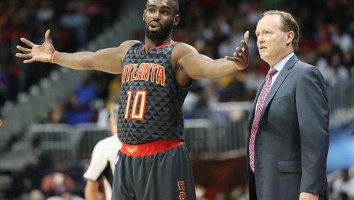Tim Hardaway Jr. averaged 14.5 points per game for  head coach Mike Budenholzer  (right) and the Hawks.  Curtis Compton /ccompton@ajc.com