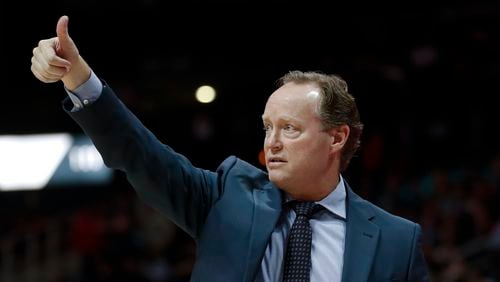 Atlanta Hawks head coach Mike Budenholzer signals to his team during the first half of an NBA basketball game against the Chicago Bulls Saturday, Jan. 20, 2018, in Atlanta. (AP Photo/John Bazemore)