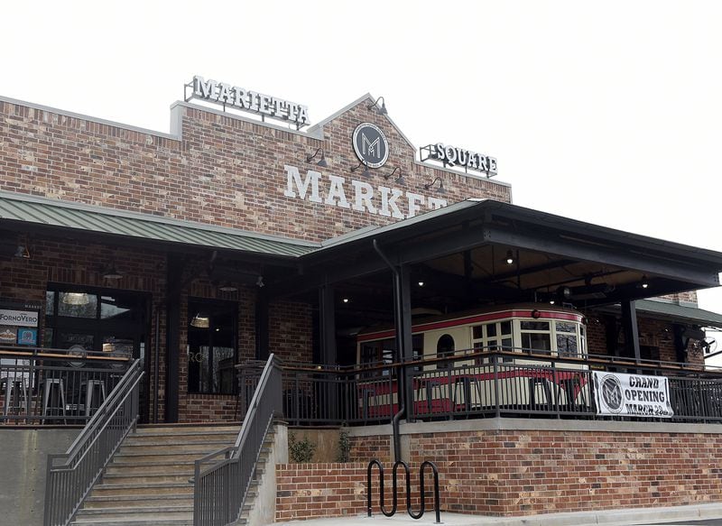 The Trolley on display at the main entrance to Marietta Square Market will become home to Pulp Addiction later this summer. RYON HORNE / RHORNE@AJC.COM