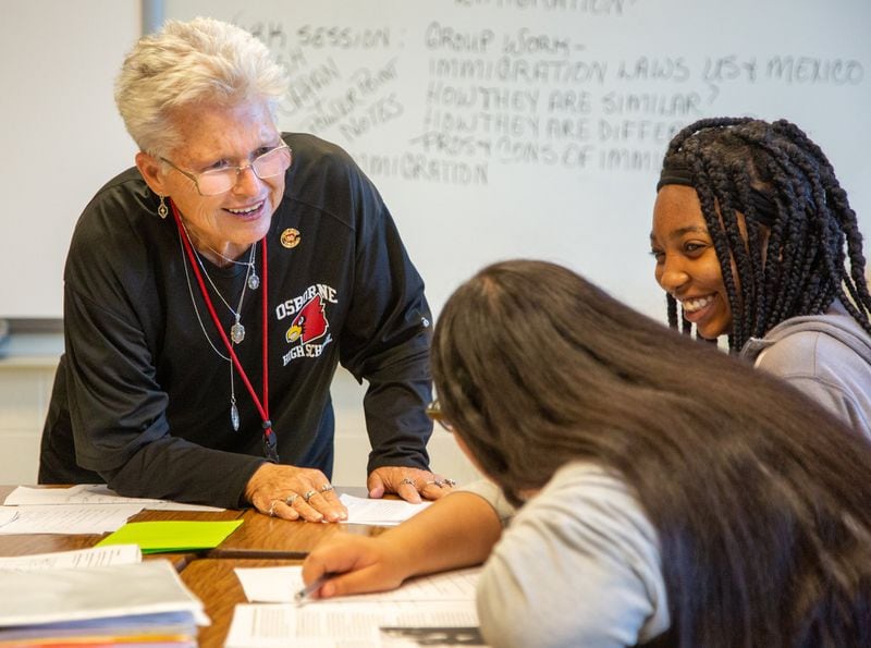 Annette Hansard laughs with a couple of her Osborne High School students on Friday Sept. 20th, 2019. She recently celebrated her 50th year of teaching social studies in the Cobb County School District. She has been at Osborne the entire time and is the department chair of the school’s social studies department. PHIL SKINNER