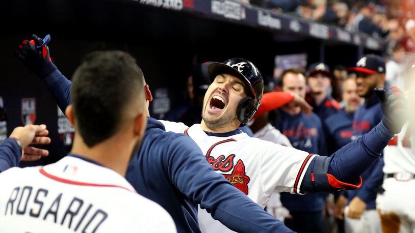 The great high of the World Series grand slam by Adam Duvall, here mightily celebrating his first-inning home run Sunday, was replaced by the disappointment of a 9-5 loss to Houston. (Curtis Compton/The Atlanta Journal-Constitution)