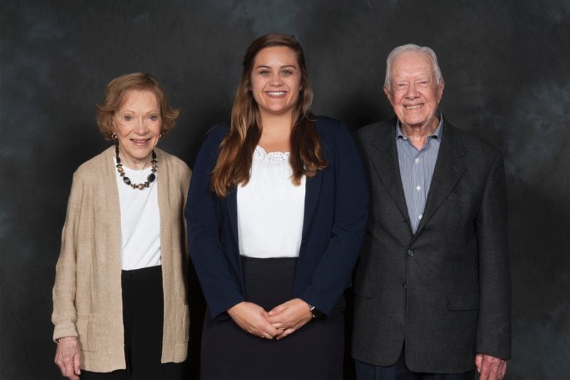 Brenda Dutton, (middle), with Rosalynn Carter and President Carter in 2017 during her internship.