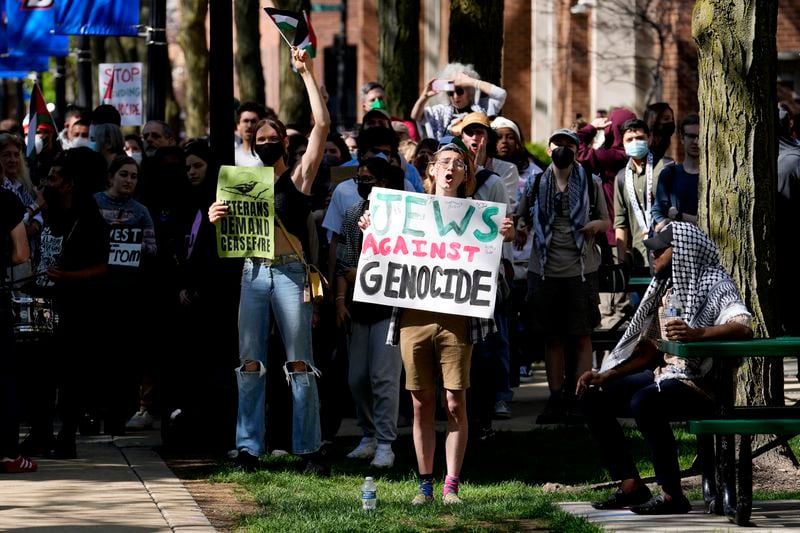 Pro-Palestinian protesters demonstrate on the campus of DePaul University, Tuesday, April 30, 2024, in Chicago. (AP Photo/Charles Rex Arbogast)