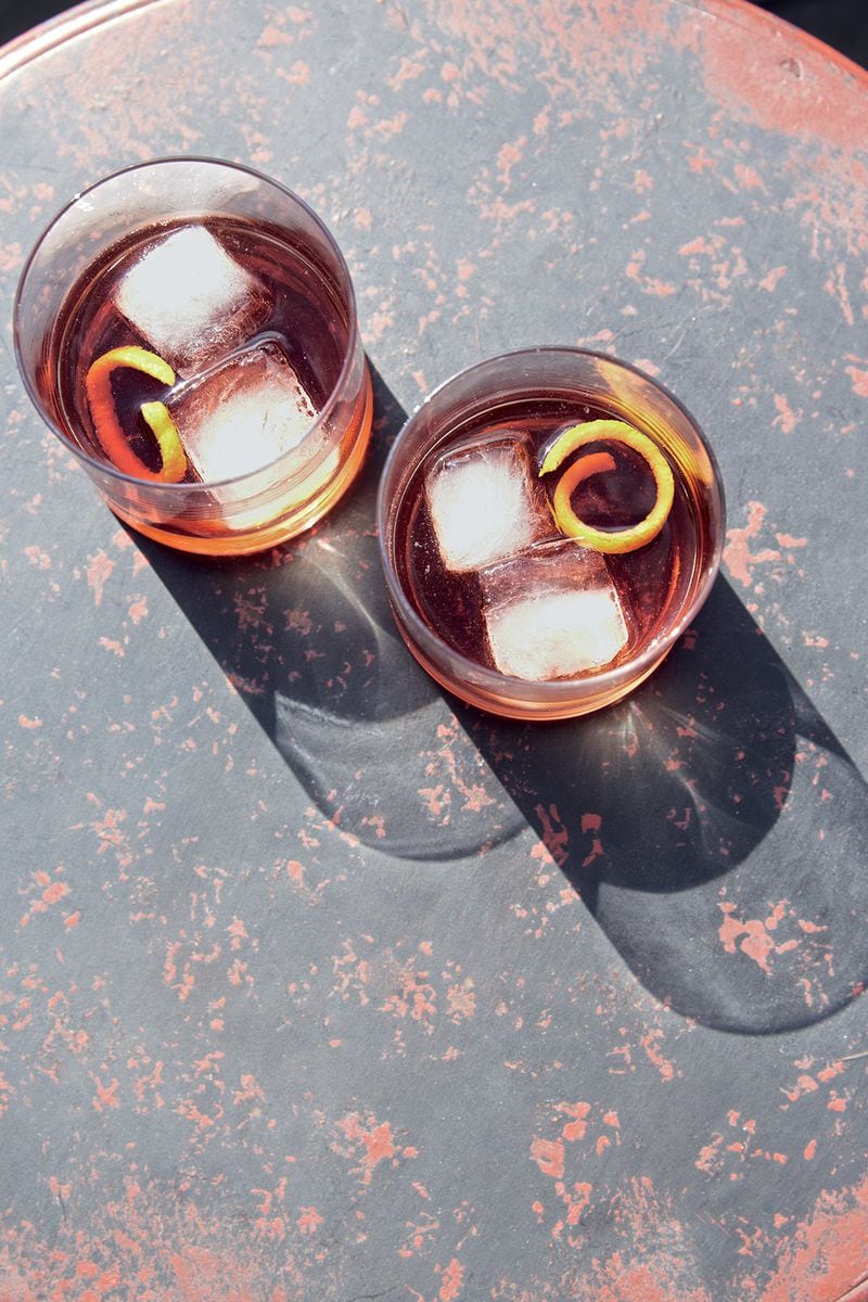 “Were it a film,” says cookbook author Kay Plunkett-Hogge, the negroni “would appear above the titles … it’s the choicest cocktail in the world.” Photo courtesy of “Aperitivo: Drinks and Snacks for the Dolce Vita,” by Kay Plunkett-Hogge, photography by Tamin Jones, Octopus Publishing, September 5, 2017, $19.95.