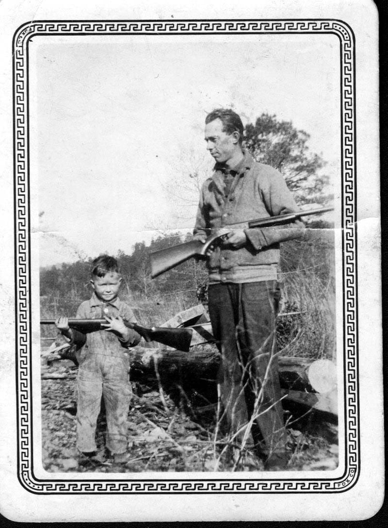 Billy Moss, seen here hunting as a child with his father Jim, was born in Talking Rock during the Great Depression in 1933. His father was a dairy cattle farmer and his mother was a homemaker. (Family photo)