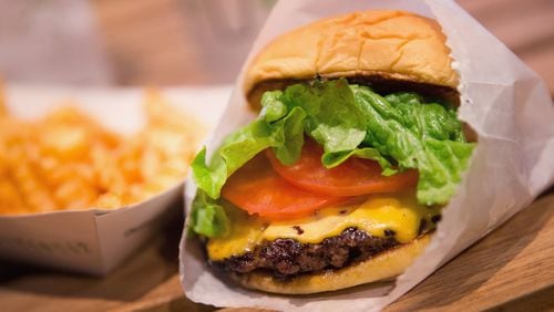 CHICAGO, IL - JANUARY 28:  In this photo illustration a cheeseburger and french fries are served up at a Shake Shack restaurant on January 28, 2015 in Chicago, Illinois. The burger chain, with currently has 63 locations, is expected to go public this week with an IPO priced between $17 to $19 a share. The company will trade on the New York Stock Exchange under the ticker symbol SHAK.  (Photo Illustration by Scott Olson/Getty Images)