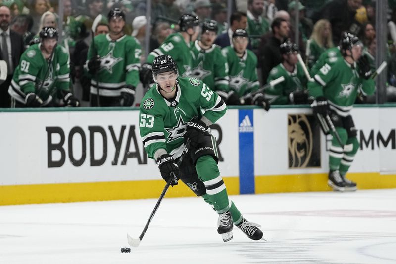 Dallas Stars center Wyatt Johnston skates with the puck against the Vegas Golden Knights during the first period in Game 2 of an NHL hockey Stanley Cup first-round playoff series in Dallas, Wednesday, April 24, 2024. (AP Photo/Tony Gutierrez)