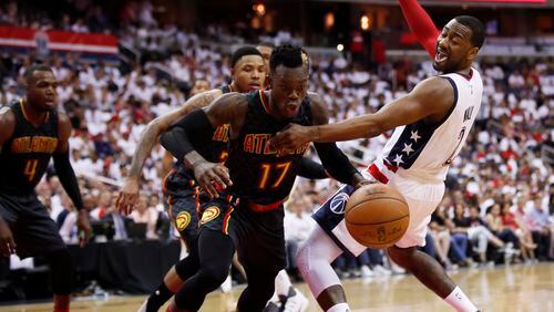 Washington Wizards guard John Wall, right, loses the ball to Atlanta Hawks guard Dennis Schroder, front second from left, during the first half in Game 1 of a first-round NBA basketball playoff series, in Washington, Sunday, April 16, 2017. The Wizards won 114-107. (AP Photo/Manuel Balce Ceneta)