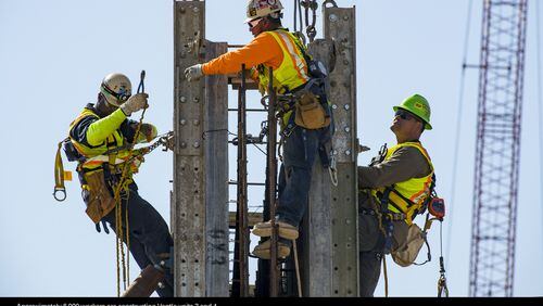 Employees work at the Plant Vogtle site. State regulators say the work pace appears to have improved. Photo: Georgia Power