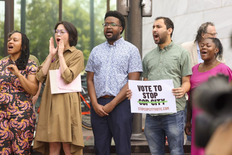 Protestors of Cop City cheer as a part of the ‘Vote to Stop Cop City’ coalition during a press conference to launch a referendum campaign to put Cop City on the ballot outside of Atlanta City Hall, Wednesday, June 7, 2023, in Atlanta. (Jason Getz / Jason.Getz@ajc.com)