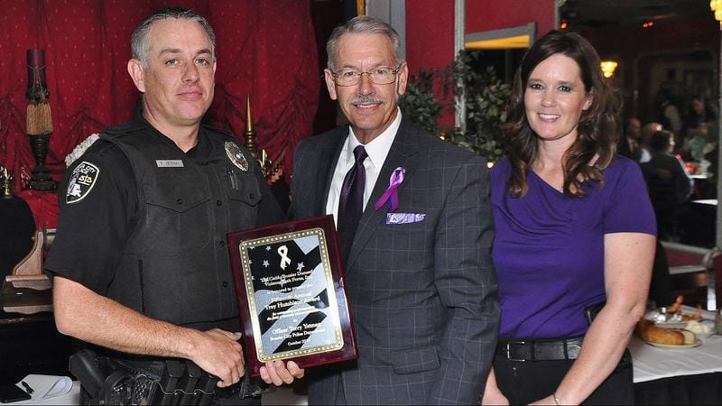 Bossier City police Officer Terry Yetman, far left, is pictured Oct. 5, 2018, with Caddo/Bossier Domestic Violence Task Force President Jim Taliaferro and Sgt. Tifani Brinkman of the Bossier City Police Department. Yetman, who was honored that day for his work with domestic violence victims and their families, was arrested Wednesday, Dec. 19, 2018, on 40 counts of animal sexual abuse. Yetman, 38, of Minden, was arrested again April 12, 2019, and charged with 31 counts of possessing child pornography. 