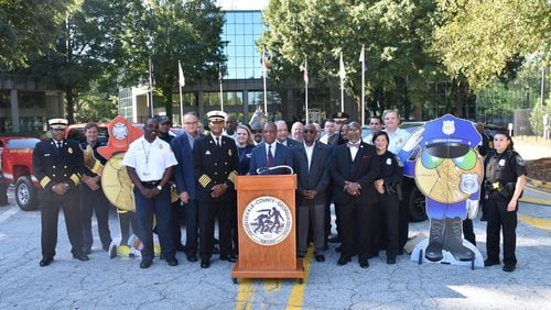 CEO Thurmond, county commissioners and public safety staff at the Sept. 19 press conference revealing new police and fire rescue vehicles purchased with SPLOST funds. CONTRIBUTED