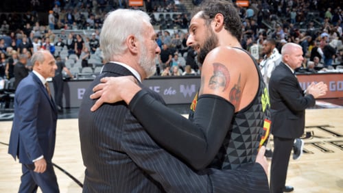 Atlanta Hawks' Marco Belinelli and San Antonio Spurs coach Greg Popovich embrace after the Spurs defeated the Hawks 96-85 on Monday, Nov. 20, 2017 in San Antonio. Photo from NBA Italia on Twitter.