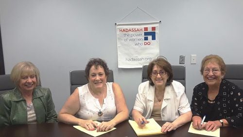 Steering Committee members Judy Roseman (from left), Jessica Stern, Vivian Gerow and Joan Solomon work on the final details of a bully prevention program set for later this month. The program is being hosted by Hadassah Greater Atlanta. CONTRIBUTED