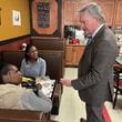 U.S. Rep. Mike Collins, R-Jackson, chats with diners at Pot Luck Cafe in Monroe before sitting down for lunch with members of his staff.