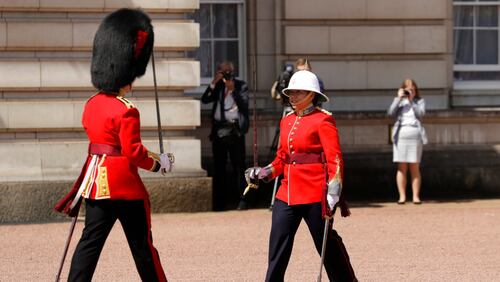 Canadian Captain Megan Couto, right, makes history by becoming the first female Captain of the Queen's Guard as she takes part in the Changing the Guard ceremony at Buckingham Palace in London, Monday, June 26, 2017. Couto and her unit, The Second Battalion, Princess Patricia's Canadian Light Infantry (2PPCLI), known as "The Patricia's", took part in the ceremony Monday to coincide with the 150th anniversary of Canada and the sesquicentennial anniversary of Canadian Confederation. (AP Photo/Matt Dunham)