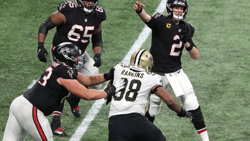120620 ATLANTA: Matt Ryan completes a pass under pressure against the Saints during the 4th quarter in a NFL football game on Sunday, Dec. 6, 2020, in Atlanta.  “Curtis Compton / Curtis.Compton@ajc.com”